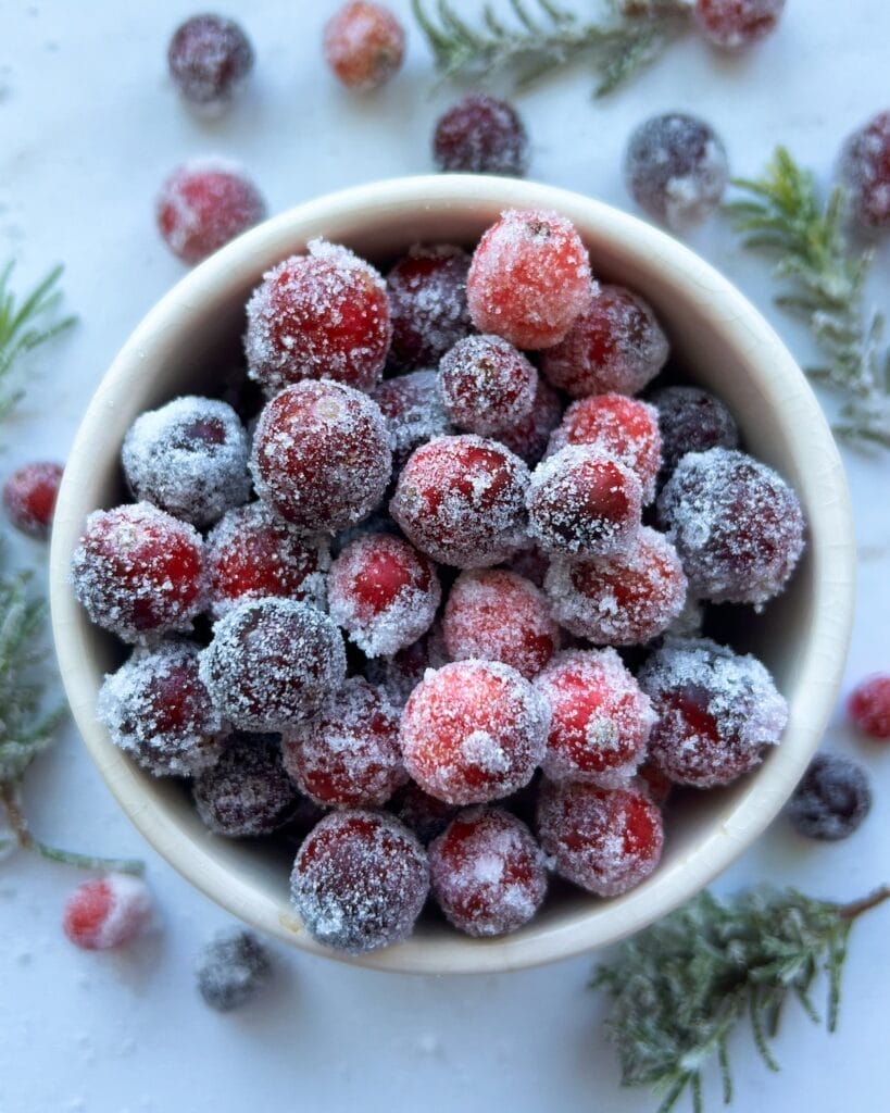 Sugared cranberries in a bowl.