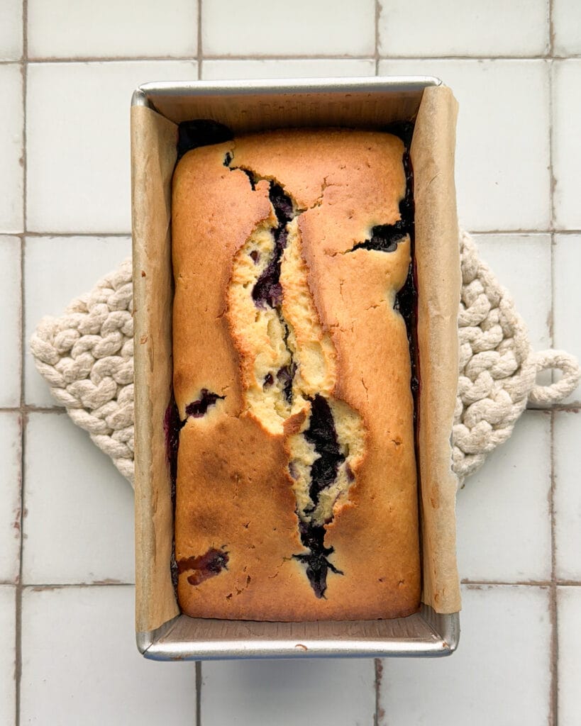 Lemon blueberry loaf in a bread pan.